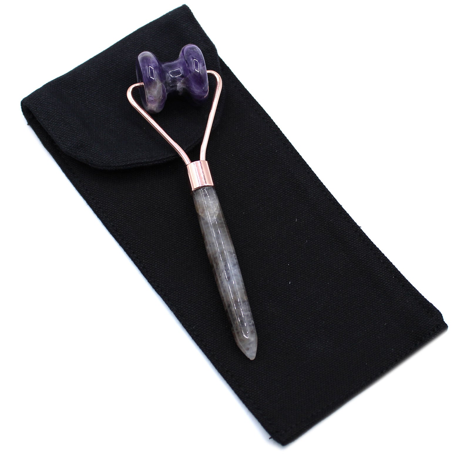 Amethyst crystal jawline roller with curved design for calming, targeted facial massage.

