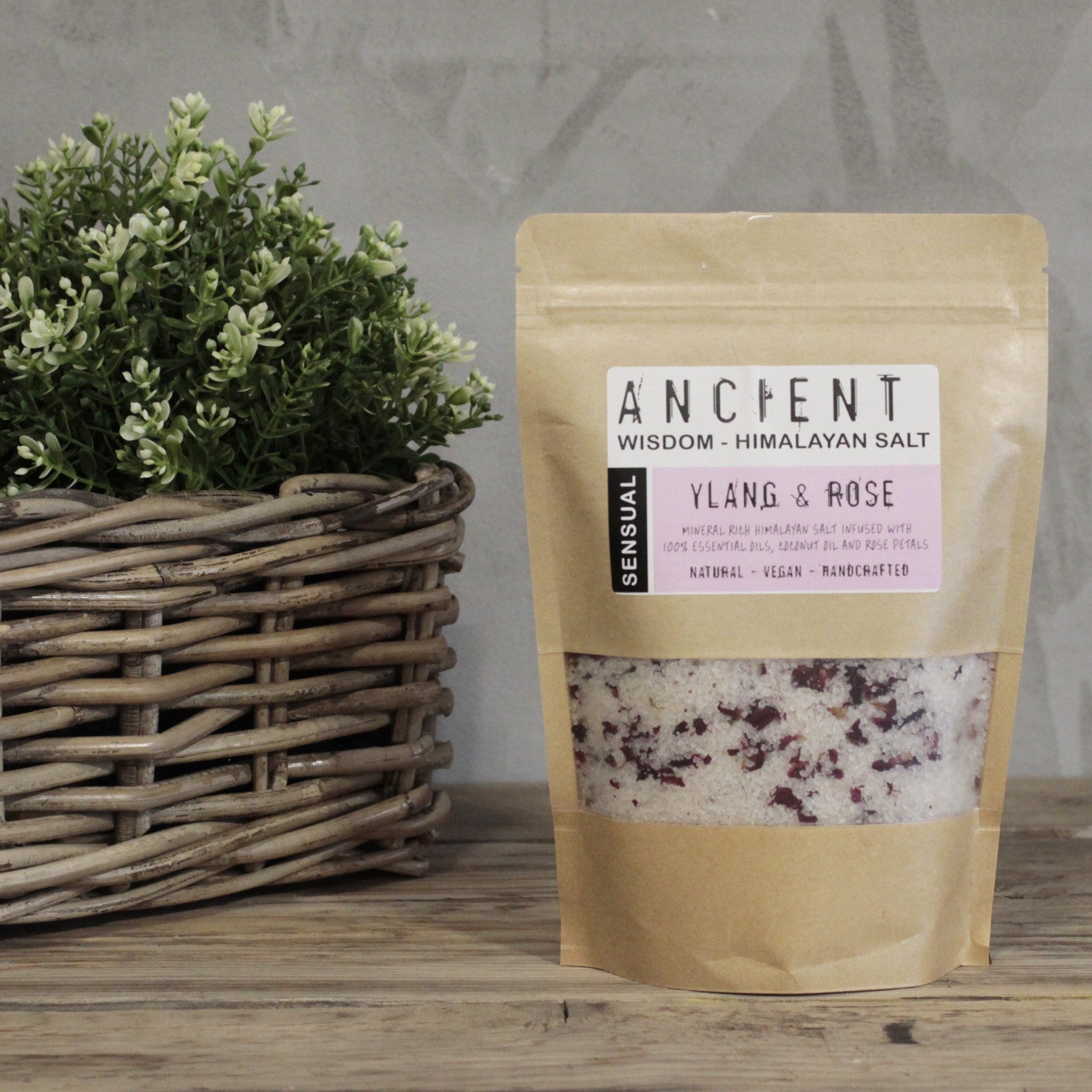 Himalayan Bath Salt Sensual blend with ylang ylang, coconut oil, and dried rose petals in a 500g pouch.

