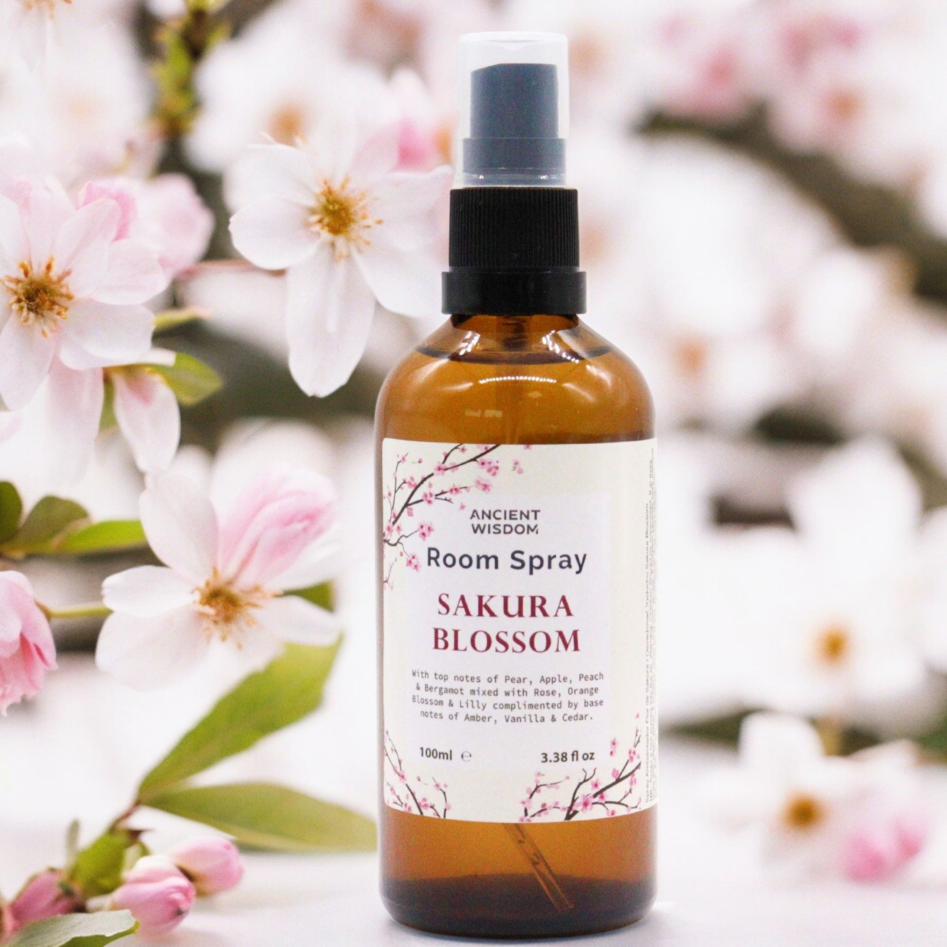 Amber bottle of Sakura Essence room spray – 100ml, with cherry blossom-inspired floral and fruity fragrance.

