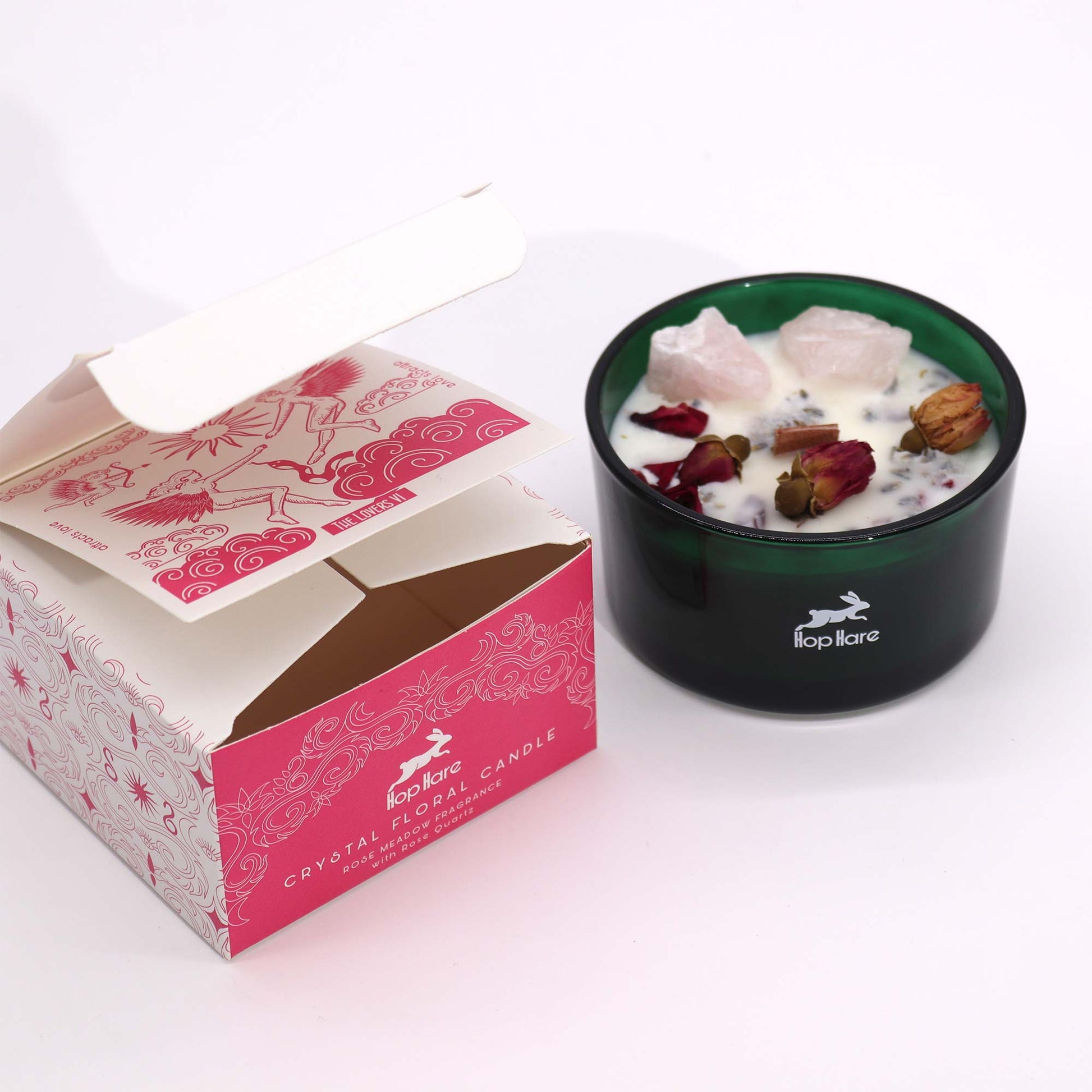 Hop Hare The Lovers crystal candle with rose quartz, rose petals, and tarot card in dark green jar
