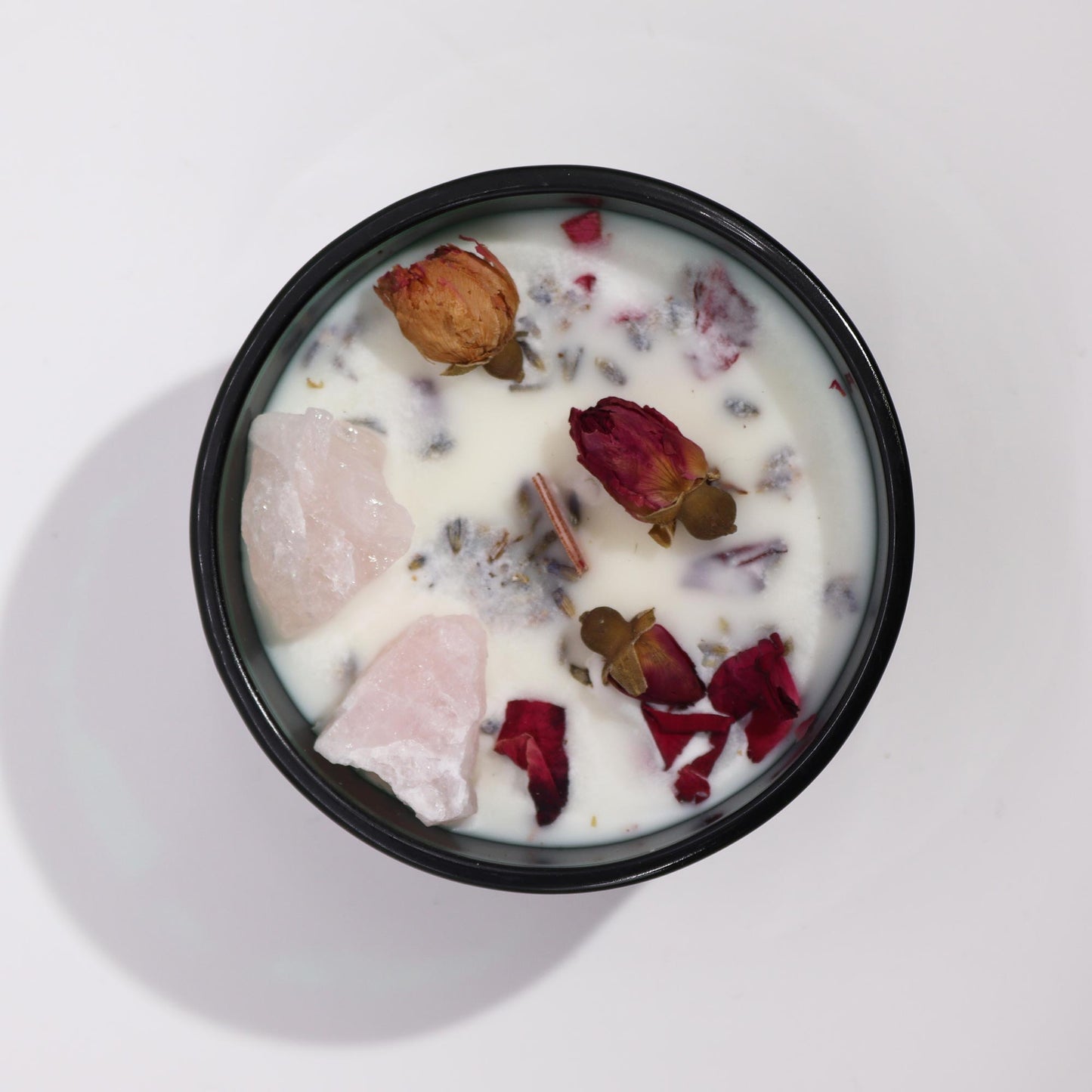 Hop Hare The Lovers crystal candle with rose quartz, rose petals, and tarot card in dark green jar
