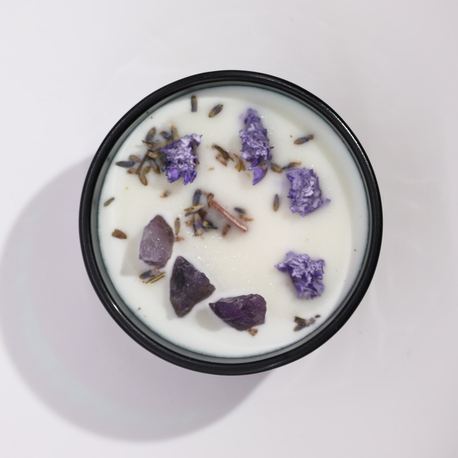 Hop Hare The Moon crystal candle with amethyst, lavender flowers, and tarot card in dark green jar
