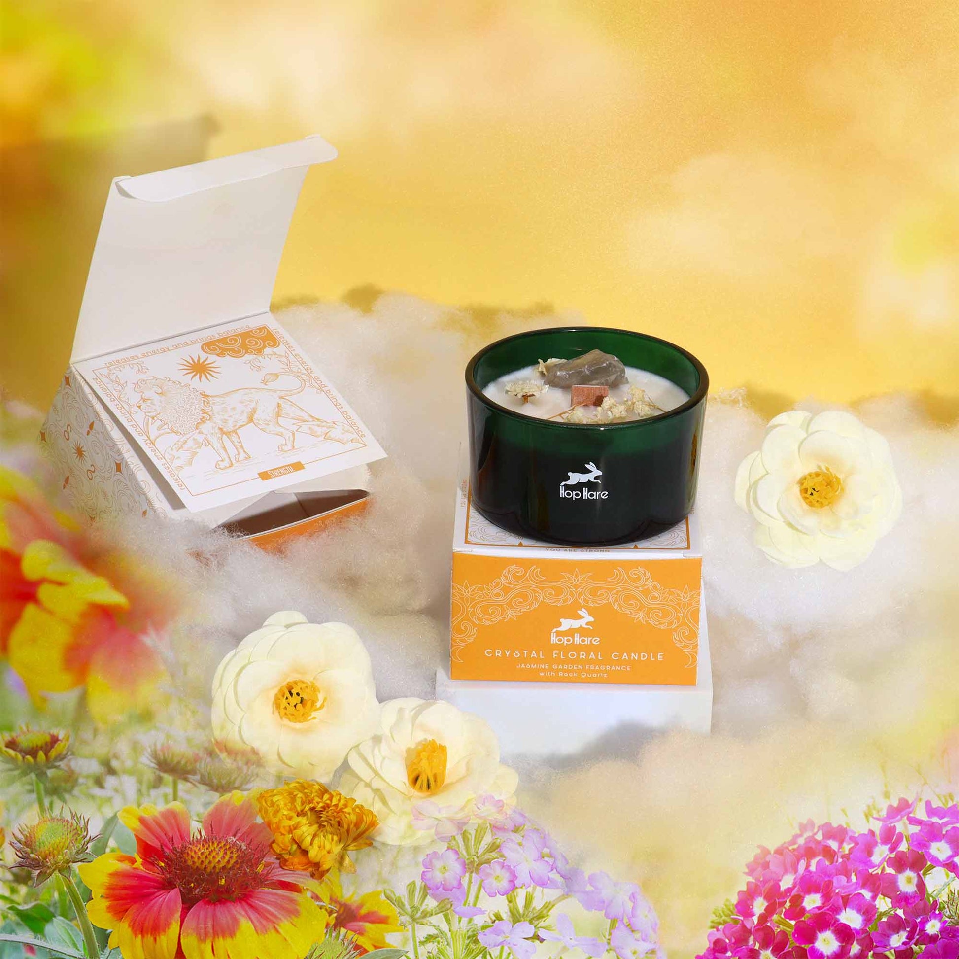 Hop Hare The Lion crystal candle with rock quartz, dried flowers, and tarot card in dark green jar
