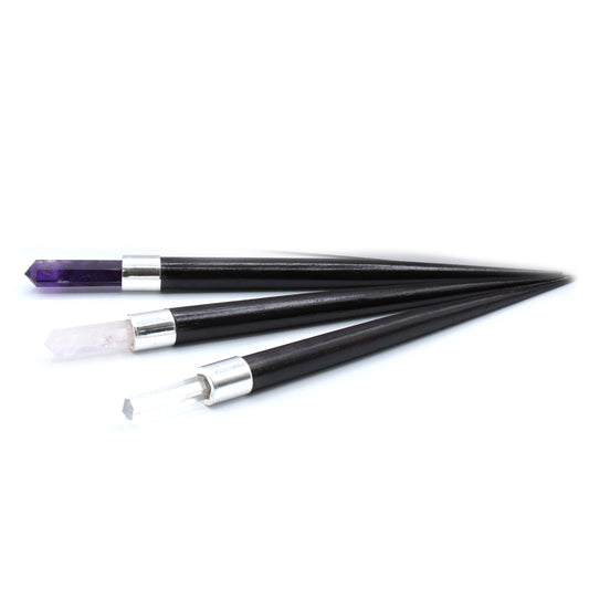 Set of 3 healing wands with pointed crystal tips: amethyst, rose quartz, and rock quartz. Featuring wooden handles and silver caps for energy work and meditation.

