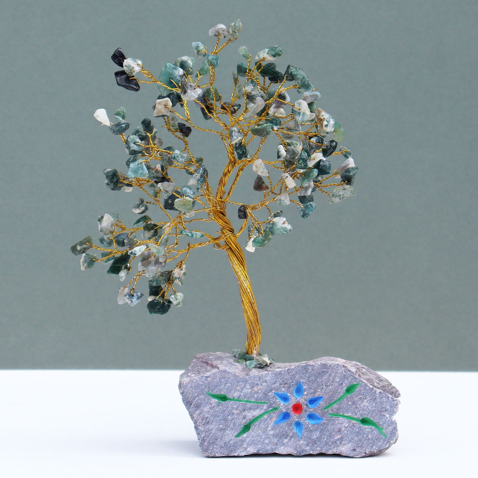 Moss agate crystal tree with hand-carved stone base

