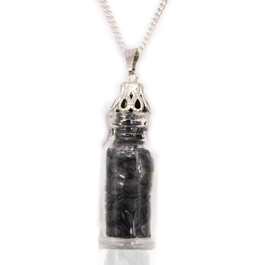 "Mini bottle necklace filled with black onyx chips, hanging from a silver-plated chain"

