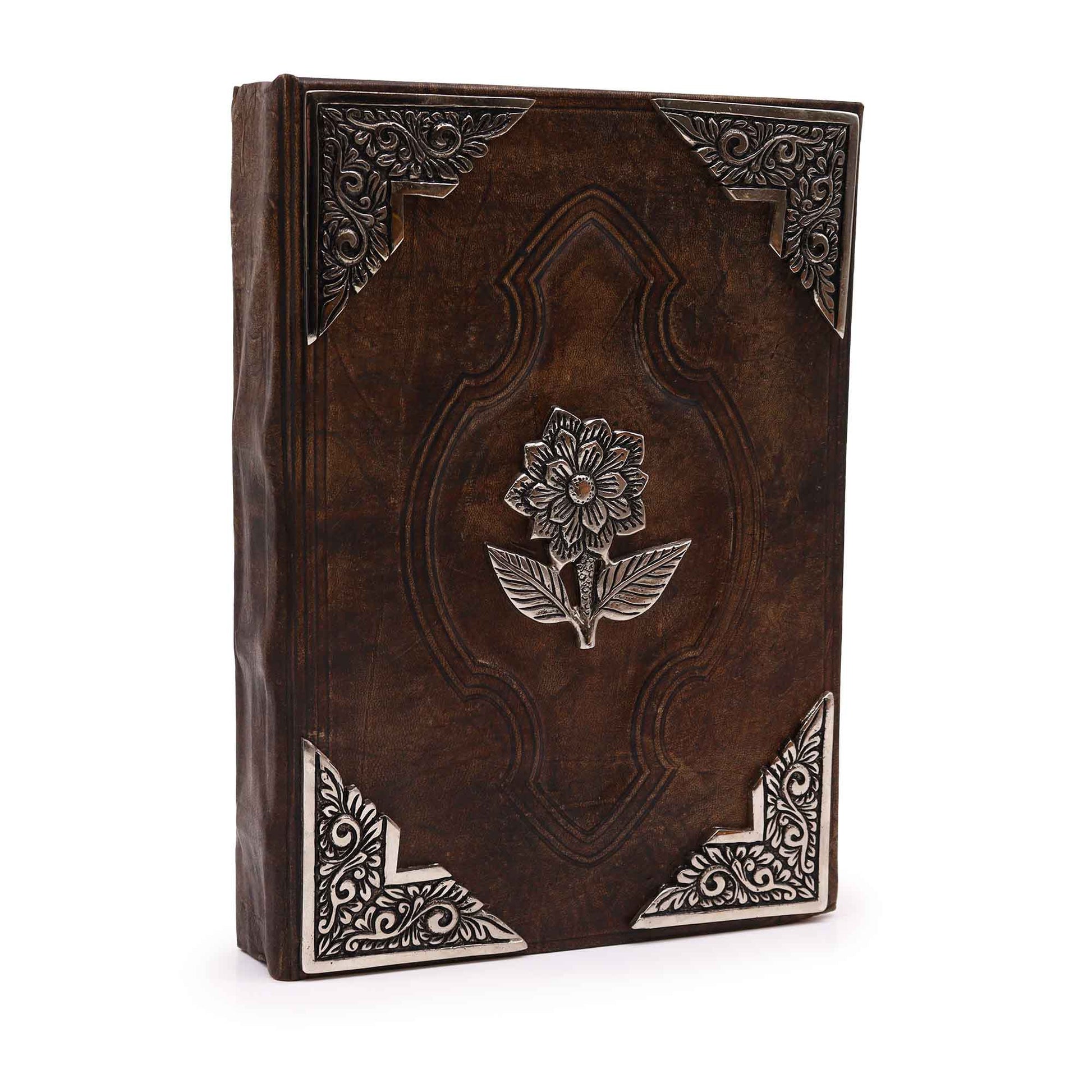 Leatherbound journal with zinc rose emblem and ornate metal corner designs

