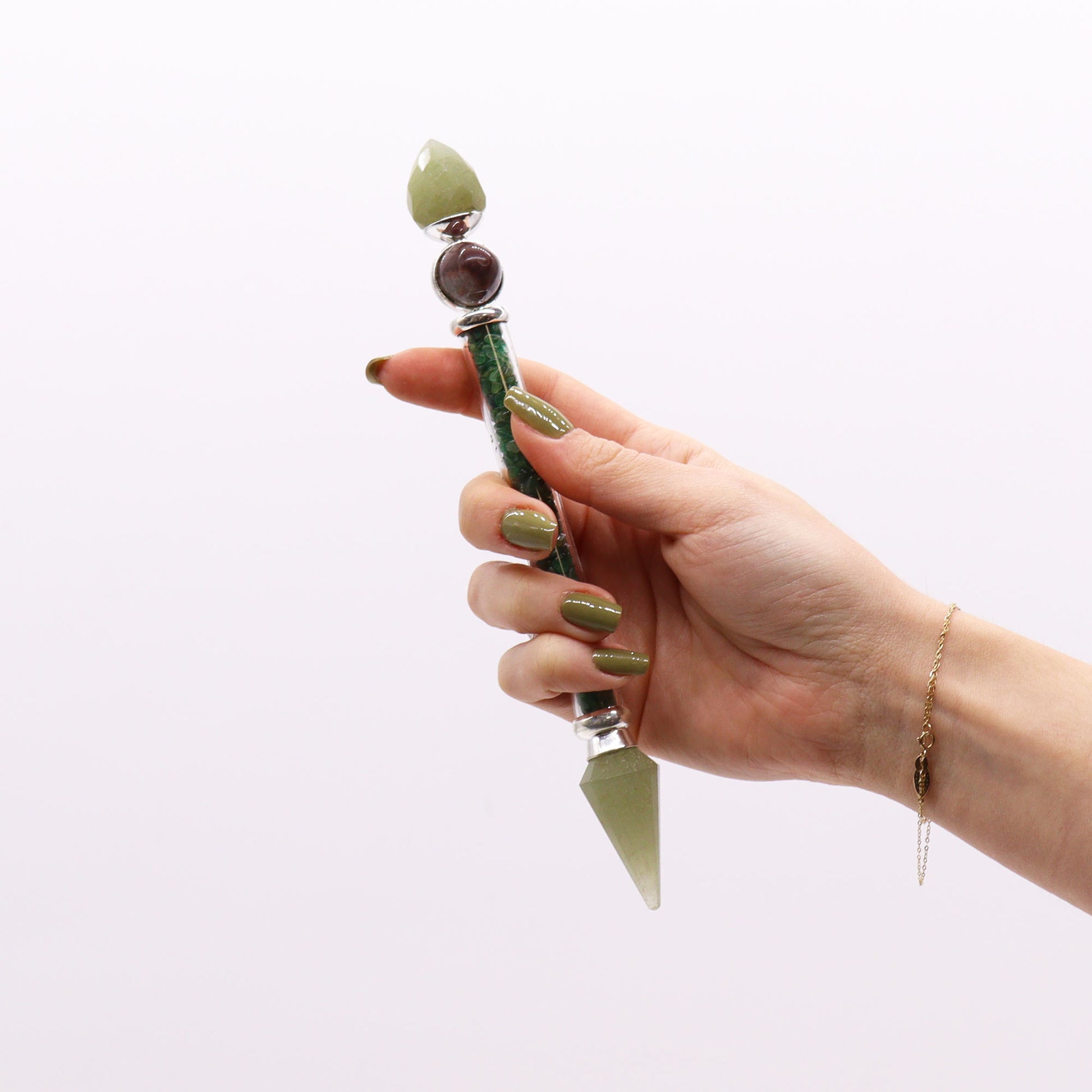 Shiva Lingam wand with green aventurine chips, crystal points, and polished Shiva Lingam stones. Ideal for heart chakra healing and energy work.

