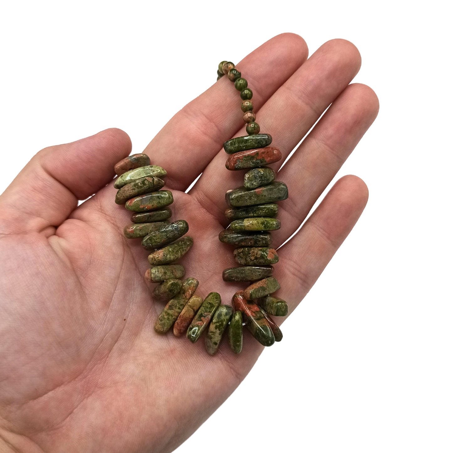 "Longstone Gem Necklace featuring natural unakite gemstone chips and matching round beads in green and pink tones, displayed on a hand."

