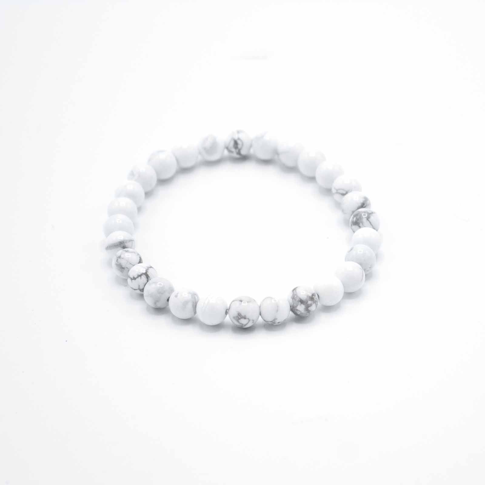 White Jasper gemstone manifestation bracelet with soft white beads, symbolising peace, emotional balance, and calm presence.

