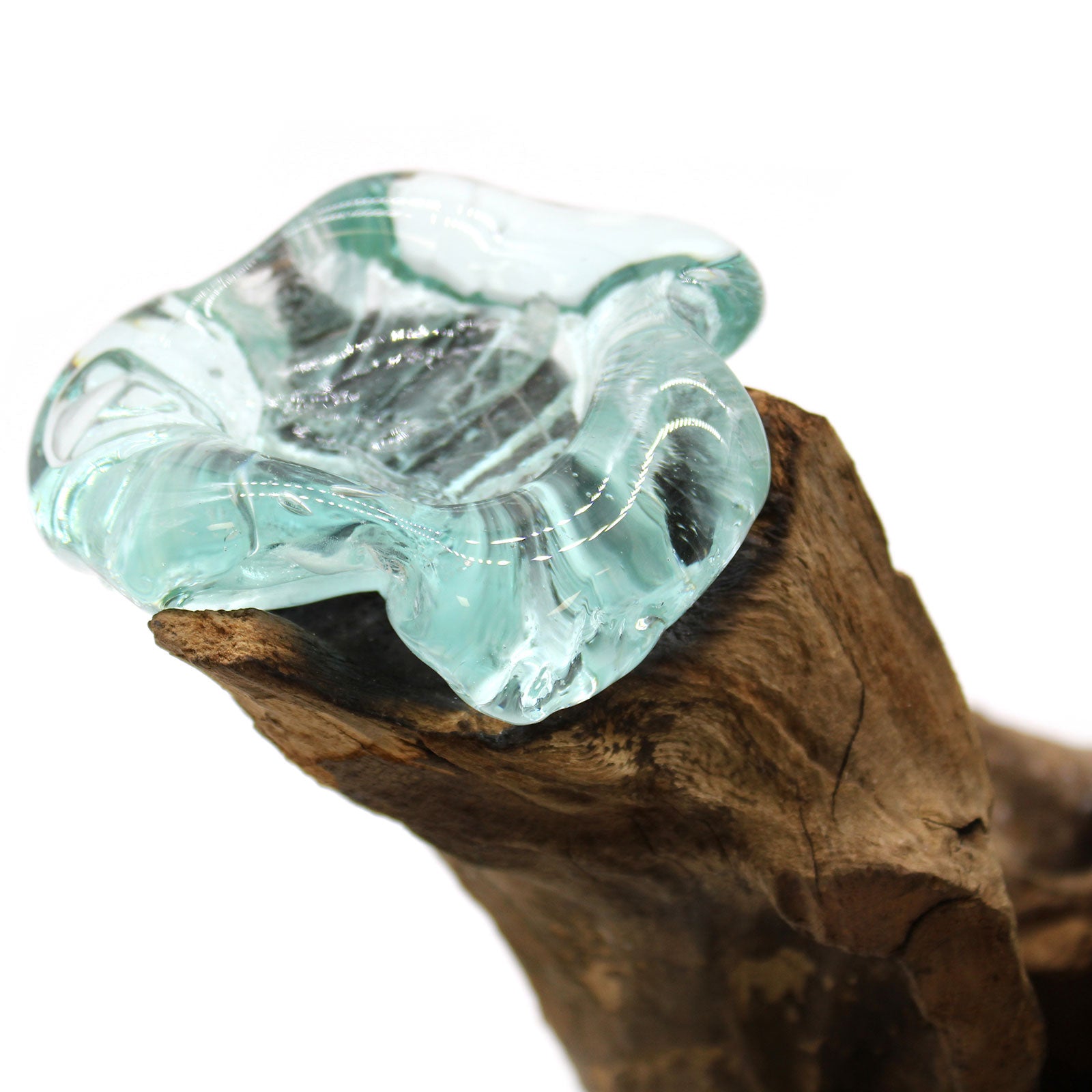 Molten glass and wood three candle holder with hand-poured tealight vessels resting on natural Balinese Gamal wood.