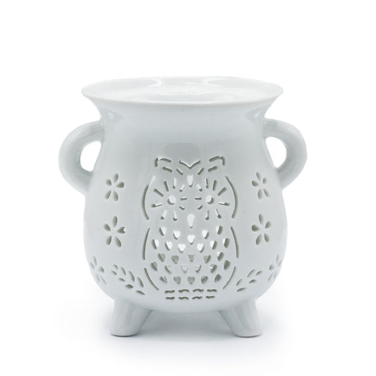 White ceramic cauldron oil burner with owl and floral cut-out design, ideal for essential oils and tealights

