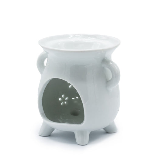 White ceramic cauldron oil burner with owl and floral cut-out design, ideal for essential oils and tealights

