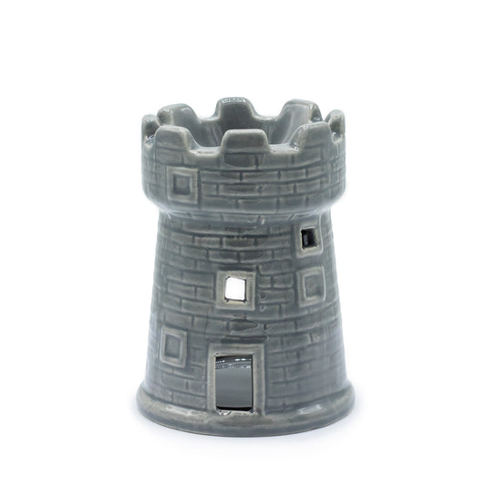 Grey ceramic oil burner shaped like a castle tower with brick detail and battlements, designed for essential oils and tealights

