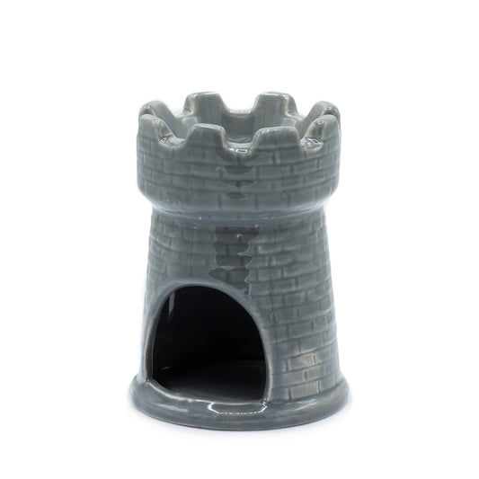 Grey ceramic oil burner shaped like a castle tower with brick detail and battlements, designed for essential oils and tealights

