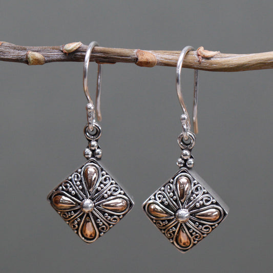 "Square sterling silver earrings with gold teardrop floral accents and scroll detailing, handcrafted in Indonesia."