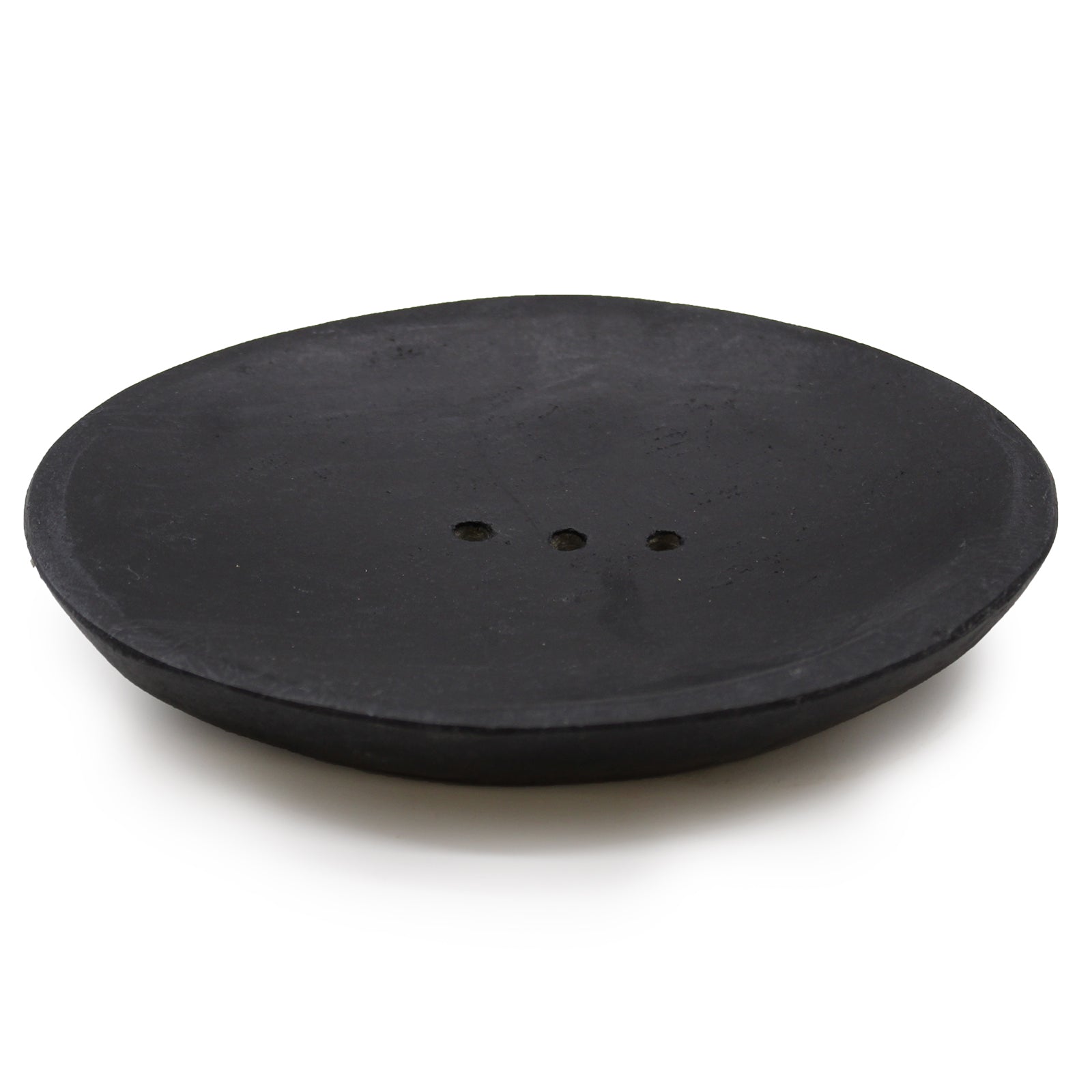 Oval black marble soap dish with drainage holes, handcrafted and minimalist.

