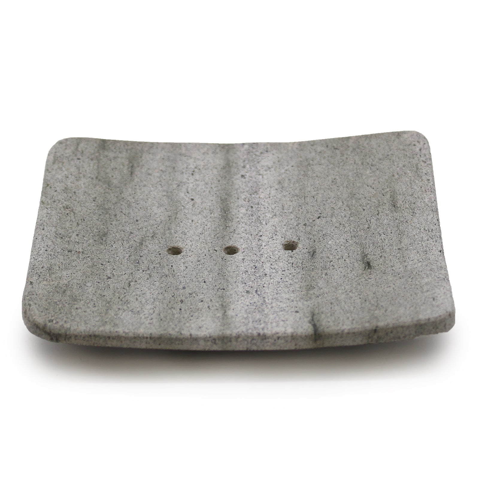 Square grey zeolite stone soap dish with drainage holes, minimalist and handcrafted.

