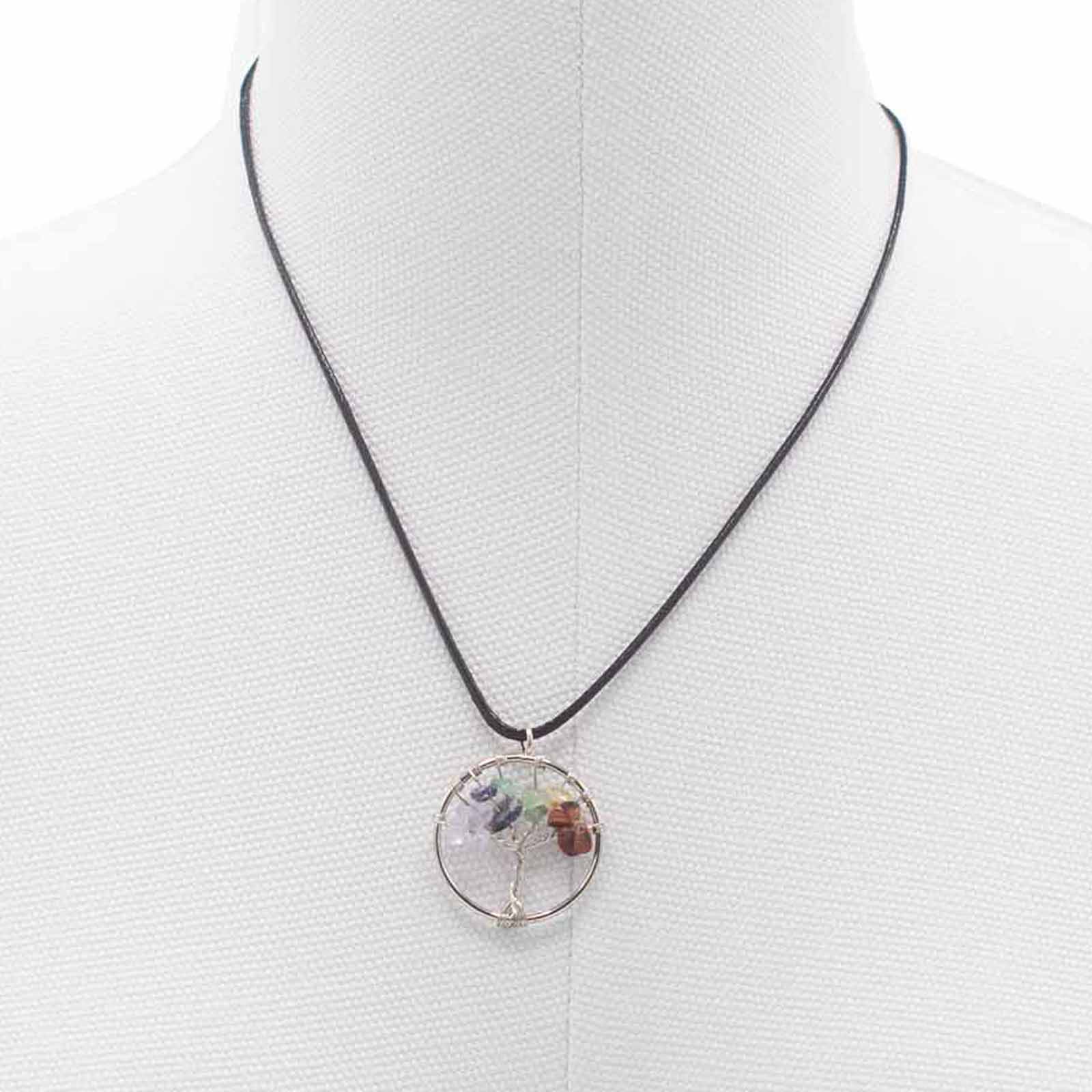 "Tree of Life Pendant featuring seven Chakra gemstones arranged in a rainbow design, crafted with silver wire on a black cord."

