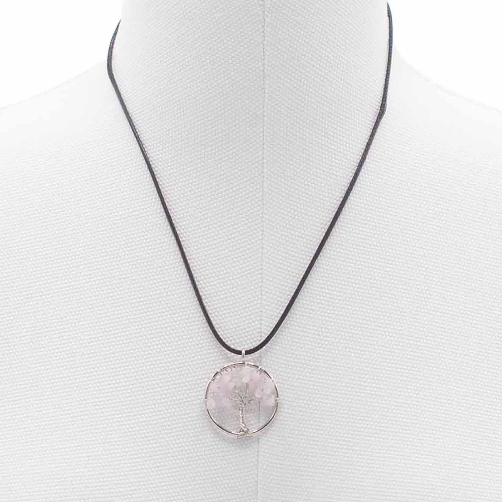 "Tree of Life Pendant with soft pink Rose Quartz gemstone, delicately wire-wrapped in silver and suspended on a black cord necklace."


