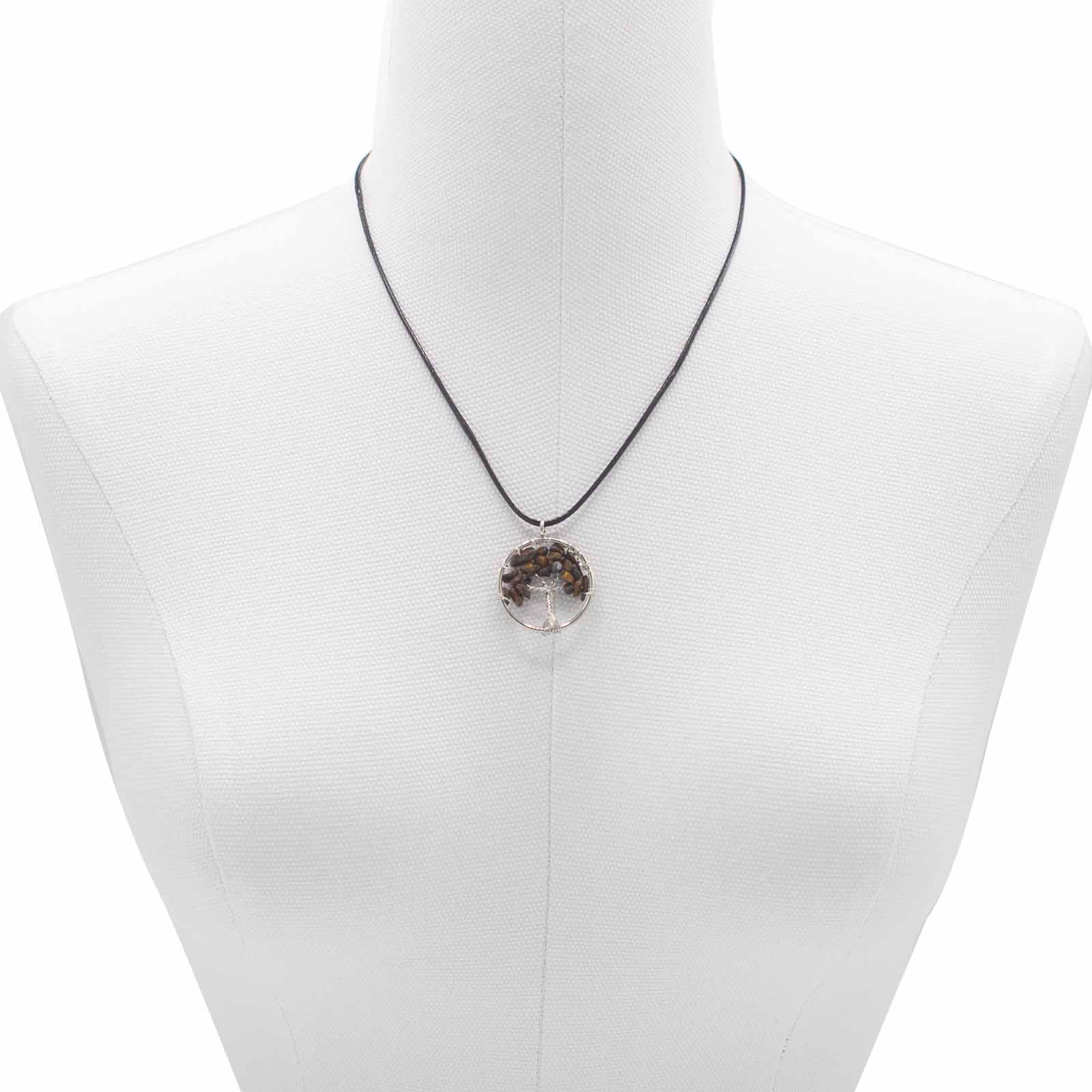 "Tree of Life Pendant featuring a golden-brown Tiger’s Eye gemstone, delicately wire-wrapped in silver, hanging on a black cord necklace."

