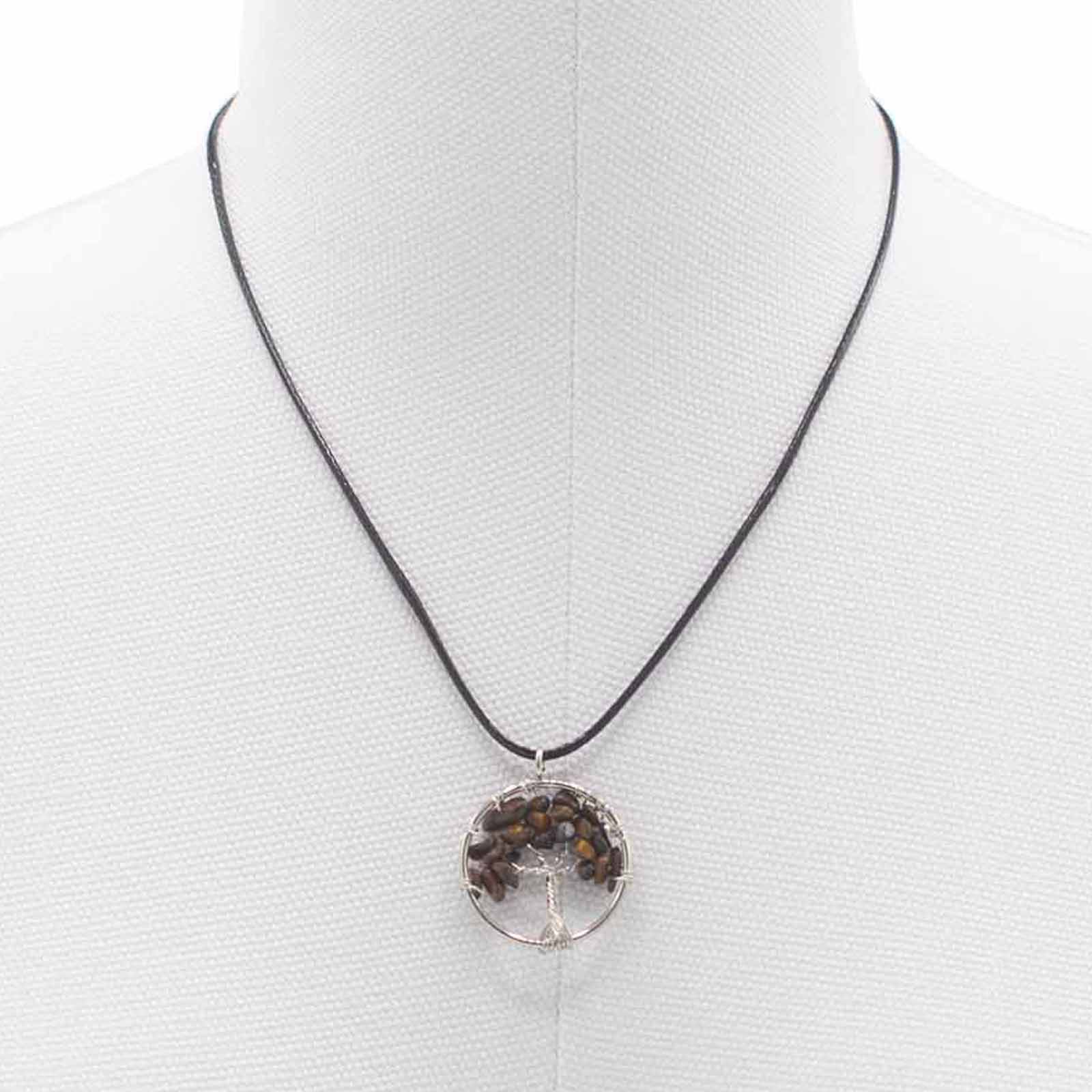 "Tree of Life Pendant featuring a golden-brown Tiger’s Eye gemstone, delicately wire-wrapped in silver, hanging on a black cord necklace."

