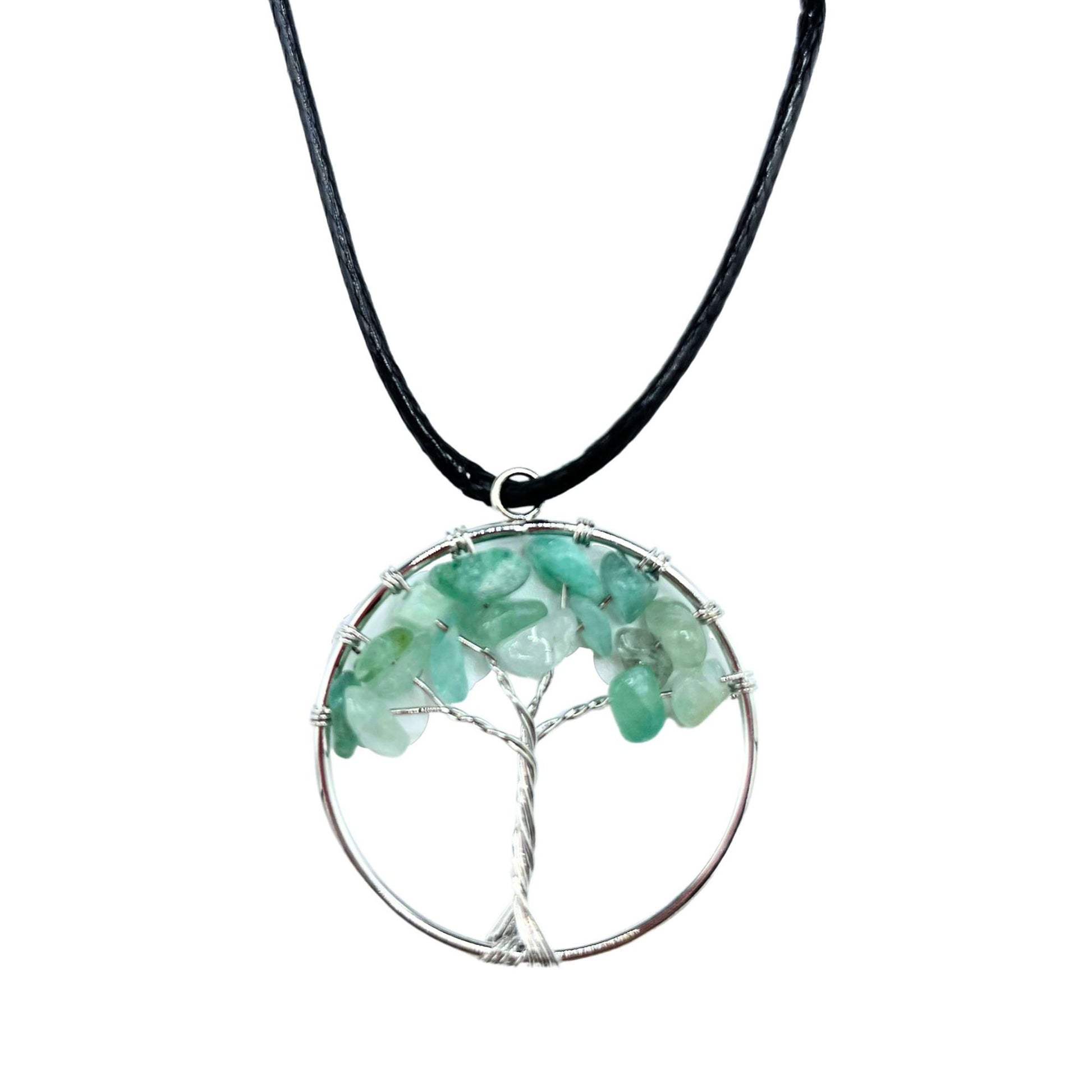 "Tree of Life Pendant with soothing green Jade gemstone and silver wire-wrapped design, hanging on a black cord."

