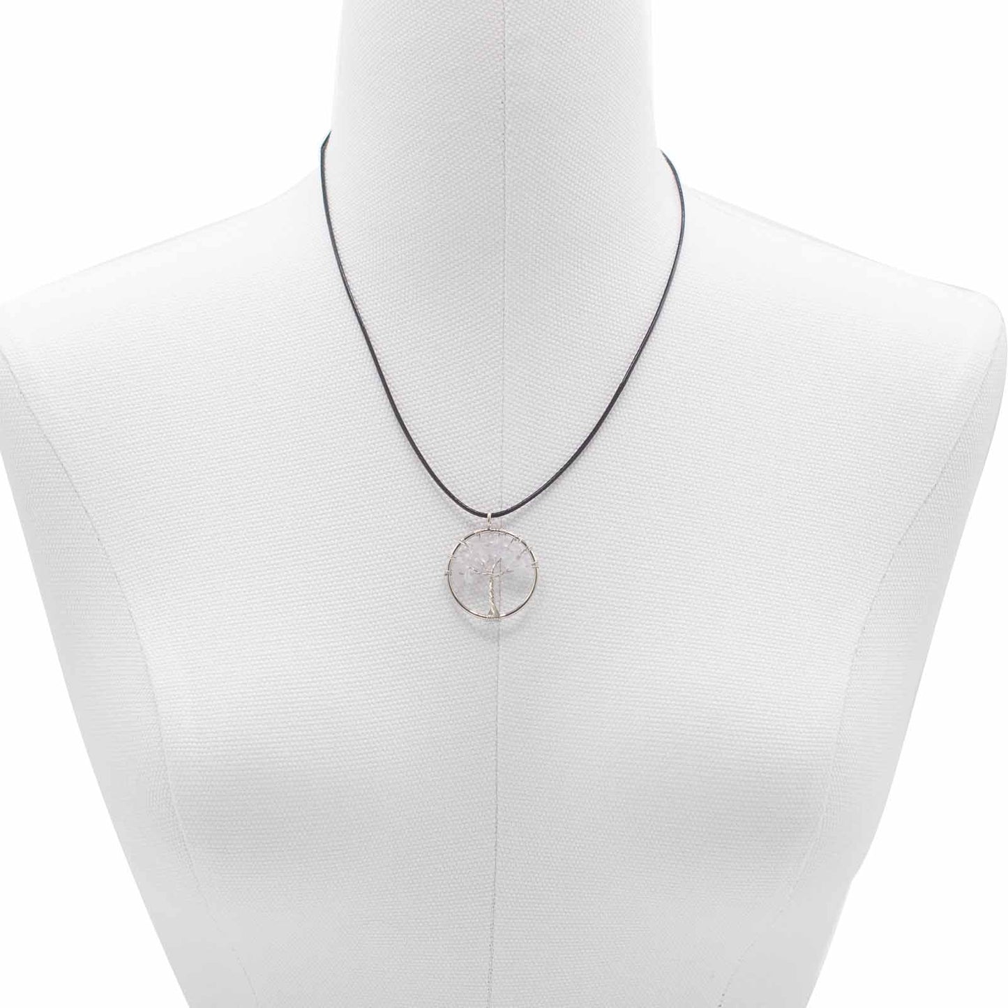 "Tree of Life Pendant with clear Rock Crystal gemstone, silver wire-wrapped design on a black cord necklace."

