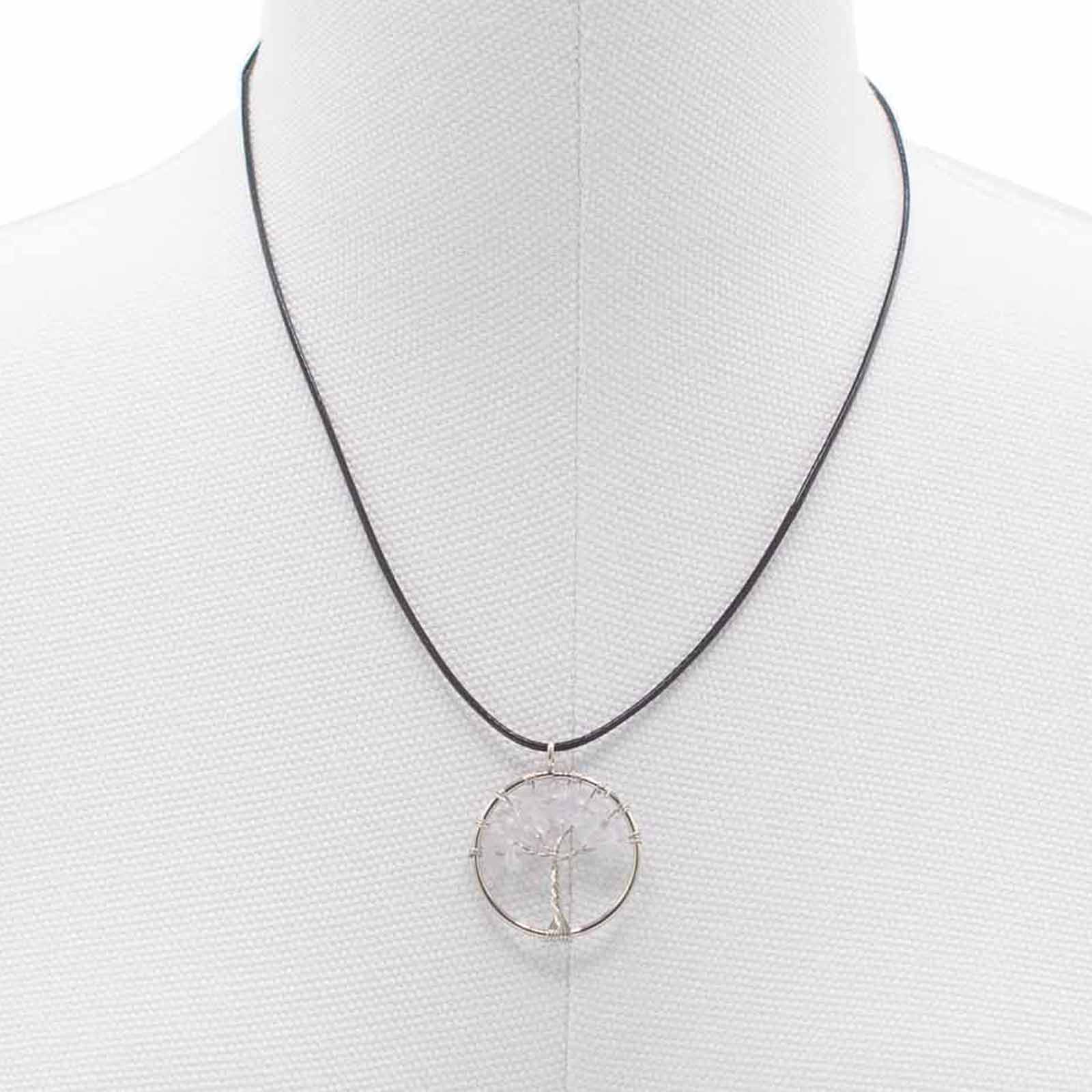 "Tree of Life Pendant with clear Rock Crystal gemstone, silver wire-wrapped design on a black cord necklace."

