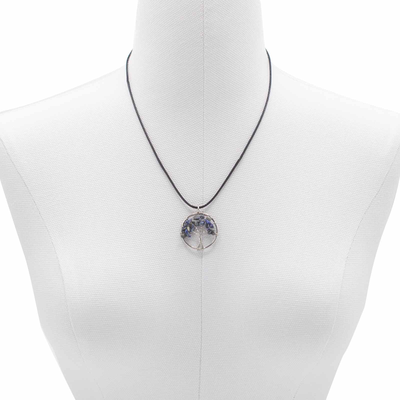 "Tree of Life Pendant with sodalite gemstone, handcrafted wire-wrapped branches on a black cord necklace."

