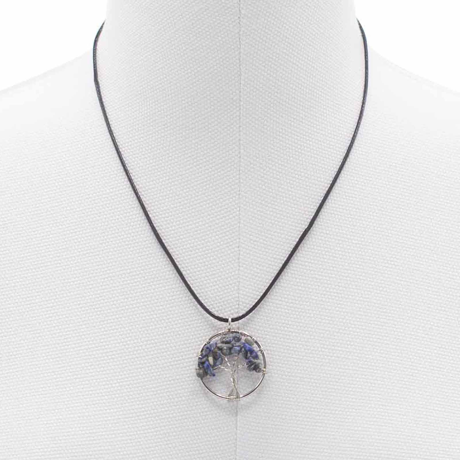 "Tree of Life Pendant with sodalite gemstone, handcrafted wire-wrapped branches on a black cord necklace."

