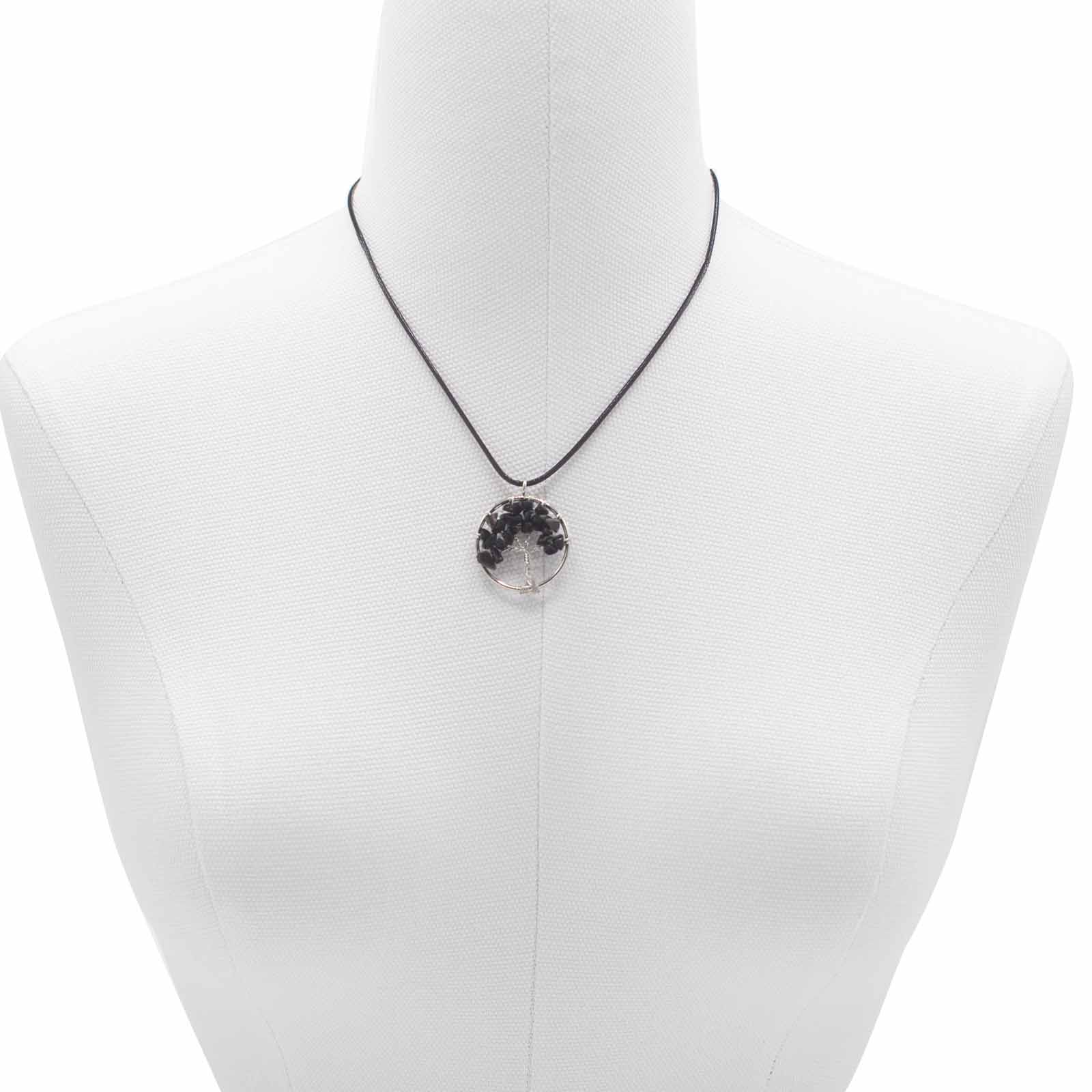 "Tree of Life pendant with black agate gemstone, silver wire-wrapped branches on a black cord necklace."

