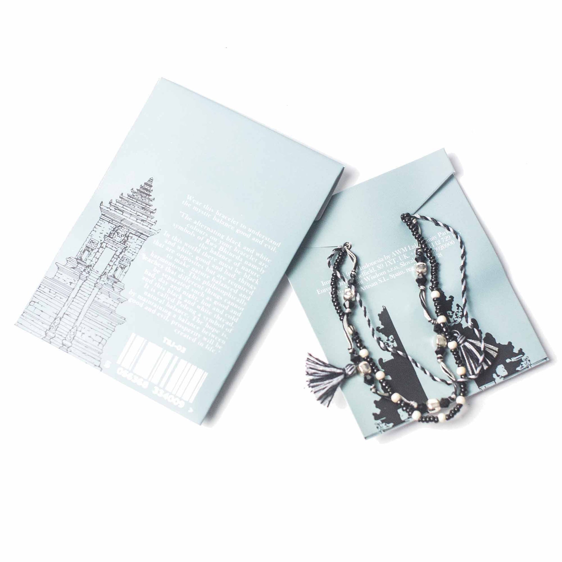 Black and white Temple String Bracelet with silver accents symbolizing natural balance and harmony through duality.

