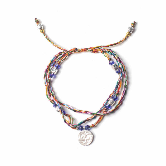 Multi-coloured Temple String Bracelet with silver Om charm symbolizing serenity, mindfulness, and presence.

