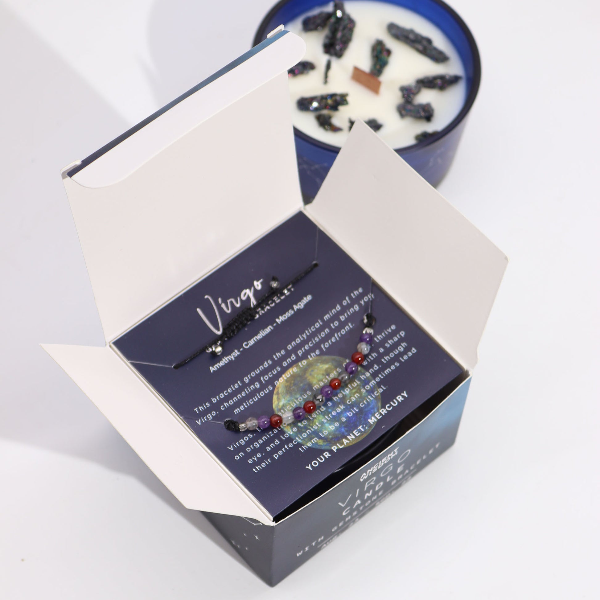 Virgo Zodiac Crystal Candle with gemstone bracelet, midnight blue jar with constellation and earthy crystal accents
